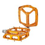 Hope F22 flat pedals with concave platform and hex pins in orange anodised finish